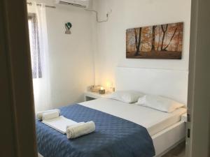 Postel nebo postele na pokoji v ubytování VILLA LEMONIA