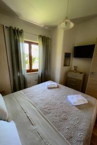 Posteľ alebo postele v izbe v ubytovaní Villetta Relax con ampio giardino a Capo Vaticano/Tropea