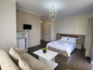 Voodi või voodid majutusasutuse MITE Hotel toas