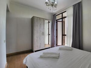 Voodi või voodid majutusasutuse MITE Hotel toas