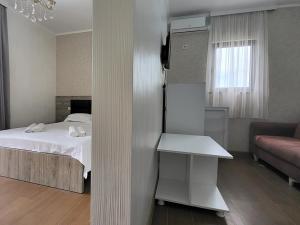 Voodi või voodid majutusasutuse MITE Hotel toas