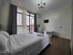 Voodi või voodid majutusasutuse MITE Hotel toas