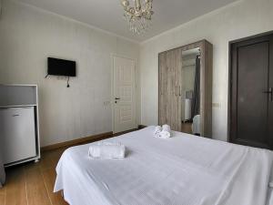 Voodi või voodid majutusasutuse MITE Hotel toas