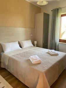 Posteľ alebo postele v izbe v ubytovaní Villetta Relax con ampio giardino a Capo Vaticano/Tropea