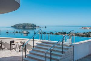 a set of stairs with a view of the water at Iberostar Waves Slavija in Budva