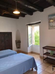a bedroom with two beds and a window at Casa Valentini in Quercitello