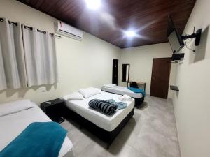 Postel nebo postele na pokoji v ubytování Hotel Serra do Mar