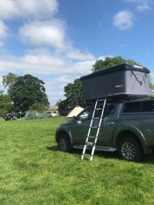 a jeep with a camper on the top of it at Hexham Tentbox Hire in Hexham
