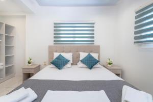 Voodi või voodid majutusasutuse Callinica Hotel toas