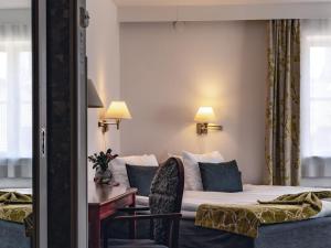 Säng eller sängar i ett rum på Best Western Strand Hotel