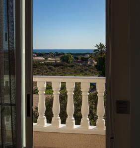 a view of the ocean from a balcony at Dormir del Mar in La Marina