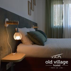 Cama ou camas em um quarto em Old Village Hostel