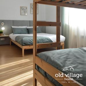 Ліжко або ліжка в номері Oldvillage Hostel