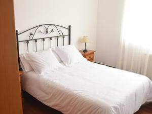 Ένα ή περισσότερα κρεβάτια σε δωμάτιο στο Casa Lolita