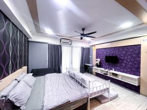 Katil atau katil-katil dalam bilik di Nizar Apartment D’Perdana +27 gambar