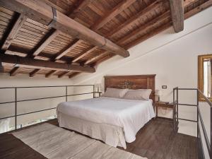 Tempat tidur dalam kamar di Agriturismo Castello Santa Margherita