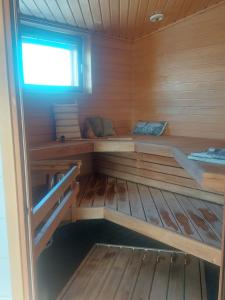 a inside of a wooden sauna with a window at Malminranta in Savonlinna