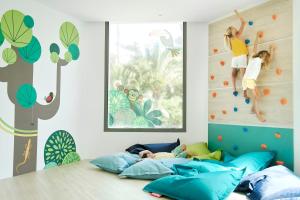 A bed or beds in a room at Iberostar Waves Cala Domingos All Inclusive