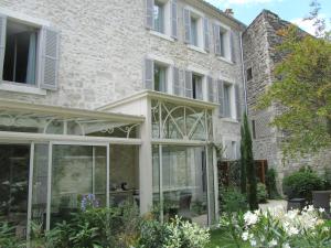 an internal view of a house with sliding glass doors at N15 - Les Confidences - Chambres d'hôtes in Avignon