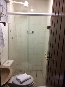 a bathroom with a shower with a toilet and a sink at Pousada Vale do Gravatá in Gravatá +29 photos