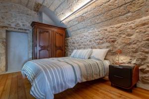 Letto o letti in una camera di Il Quinto Elemento - Residence Of Charme
