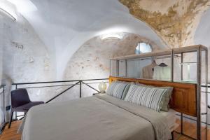 Letto o letti in una camera di Il Quinto Elemento - Residence Of Charme