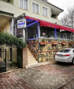 a car parked in front of a miod store at Yağız İndigo Blue in Şile