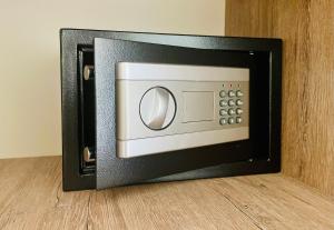 a microwave oven sitting on top of a wooden floor at Sea Line Hotel in Shekvetili