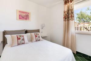 Cama ou camas em um quarto em Don Leonardo - pool and wellness