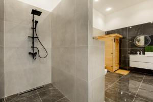 a bathroom with a shower and a sink at SUPER CENTRAL 2BR-2BT with Balcony&View&Sauna&Jacuzzi in Budapest