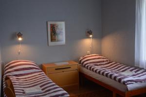 Säng eller sängar i ett rum på K15HOSTEL guest apartments