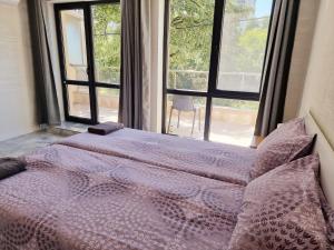 En eller flere senge i et værelse på СТУДИО АВА