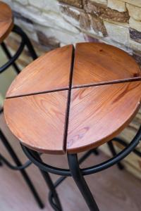 a wooden bench sitting on top of a chair at Nadmorskie Miejsce Apartament Gdynia in Gdynia +20 photos