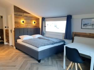 Postel nebo postele na pokoji v ubytování WALDVILLA Bad Kleinkirchheim