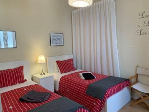 Ένα ή περισσότερα κρεβάτια σε δωμάτιο στο Casa da Foz
