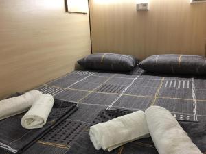 Postel nebo postele na pokoji v ubytování Bonvenon capsule Hostel