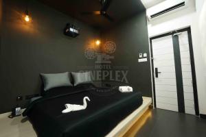 Кровать или кровати в номере Hotel Cineplex