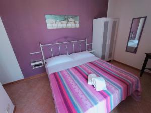 Un ou plusieurs lits dans un hébergement de l'établissement Agriturismo Raggio di Sole Nonna Giovina