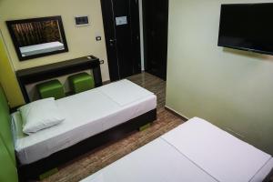 Voodi või voodid majutusasutuse Hotel Magic toas