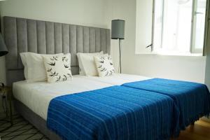 Tempat tidur dalam kamar di Vila Intendente - Apartamento 2 Quartos