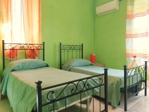 Postel nebo postele na pokoji v ubytování Casa Vacanze La Piazzz