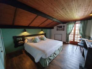 Postel nebo postele na pokoji v ubytování Locanda Il Rustichello