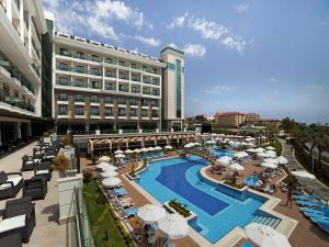 an overhead view of a hotel with a pool and umbrellas at Luna Blanca Resort & Spa in Side