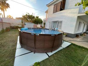 a large swimming pool in a yard next to a house at Casa Cossis in Vinaròs