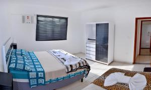 Ένα ή περισσότερα κρεβάτια σε δωμάτιο στο Apartamentos Terras Altas