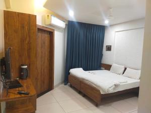 Hotel Kartiki客房内的一张或多张床位
