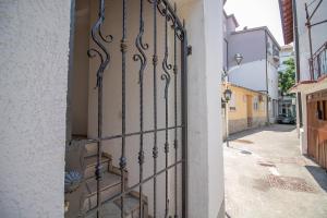a gate to a building with a street at Miro apartments in Mostar