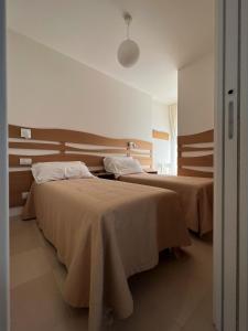 Uma cama ou camas num quarto em Curri Case al Mare