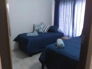Ένα ή περισσότερα κρεβάτια σε δωμάτιο στο St Lucia Villa Mia 5