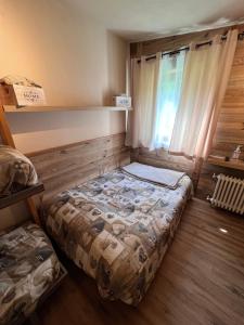Posteľ alebo postele v izbe v ubytovaní CASA CERVINIA SHUSS 2